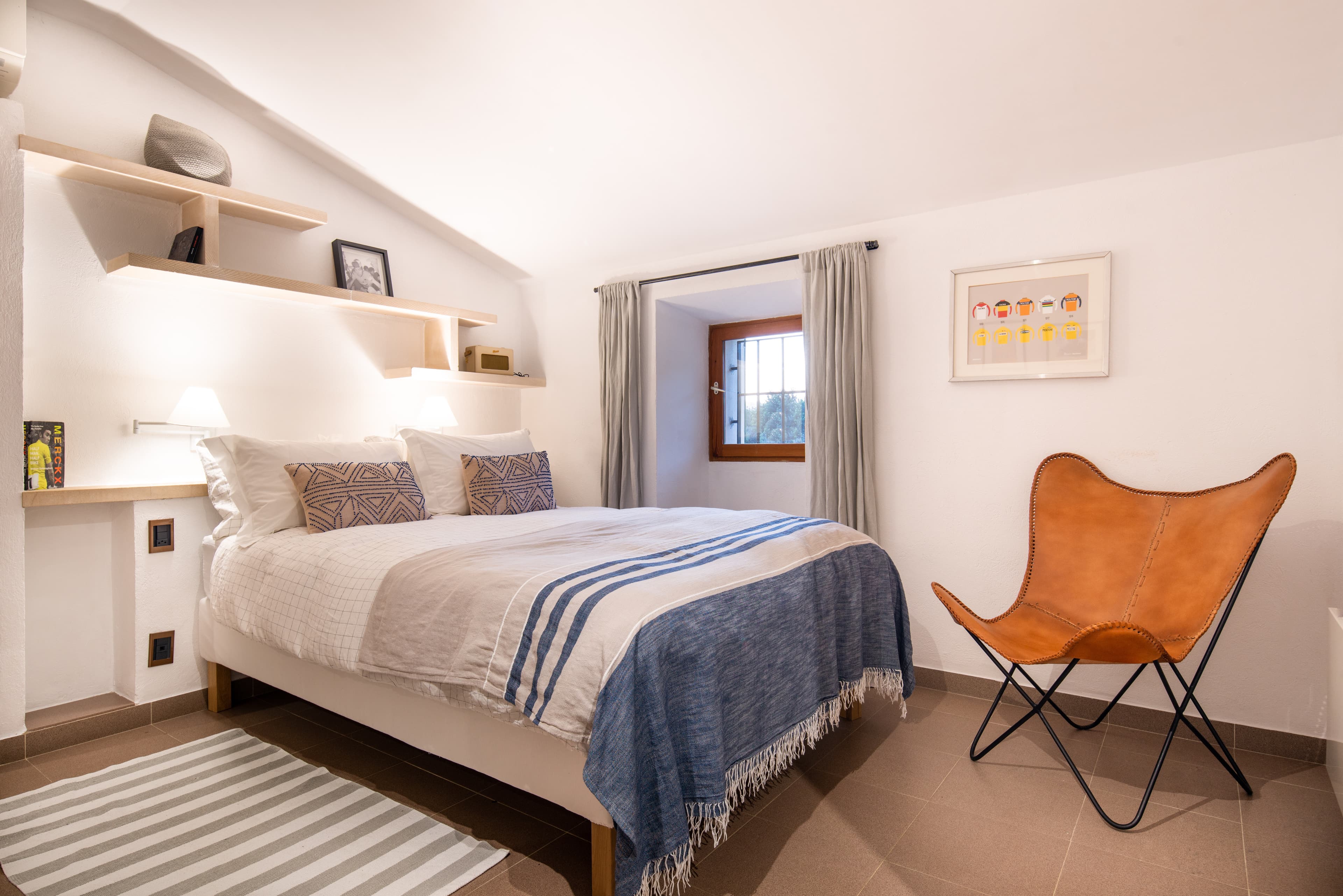 The Merckx bedroom at Casa de Ciclista, with a full en-suite bathroom